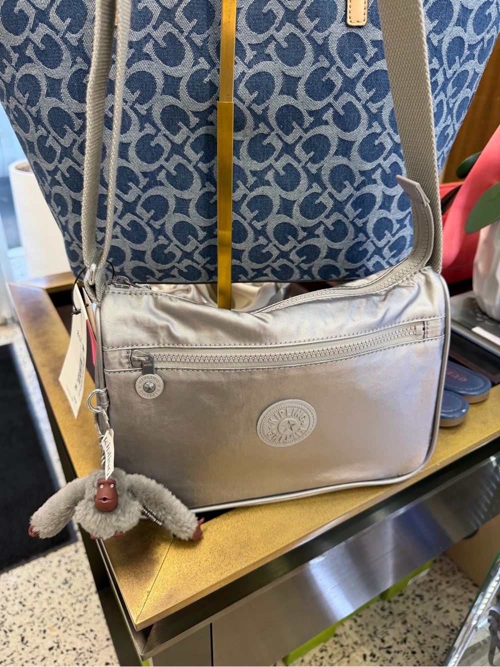Kipling Metallic Silver Crossbody with Plush Monkey Charm